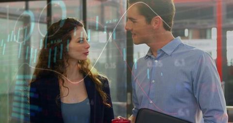 Colleagues Analyzing Financial Charts at Modern Office