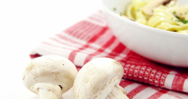 Fresh Mushrooms and Pasta Dish on Red Checkered Cloth - Download Free Stock Images Pikwizard.com