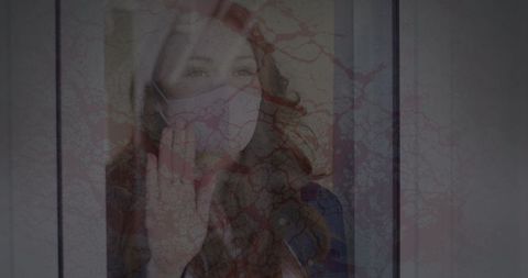 Pandemic loneliness woman in mask behind fractured glass
