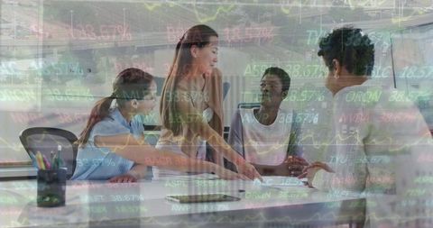 Diverse female team collaborating amidst financial data overlay