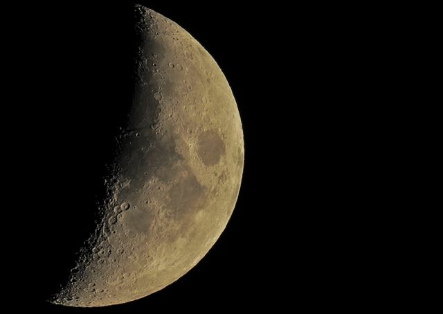 Detailed Crescent Moon with Visible Craters in Dark Sky - Download Free Stock Photos Pikwizard.com