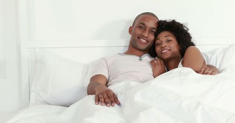 Happy African American Couple Relaxing Together in Bed - Download Free Stock Images Pikwizard.com