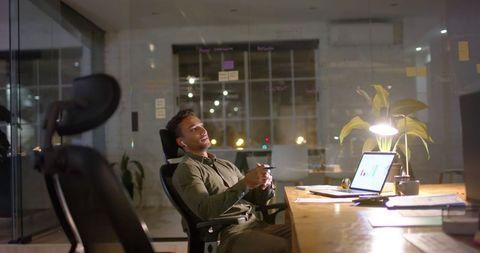 Businessman Working Late in Dimly Lit Modern Office - Download Free Stock Images Pikwizard.com