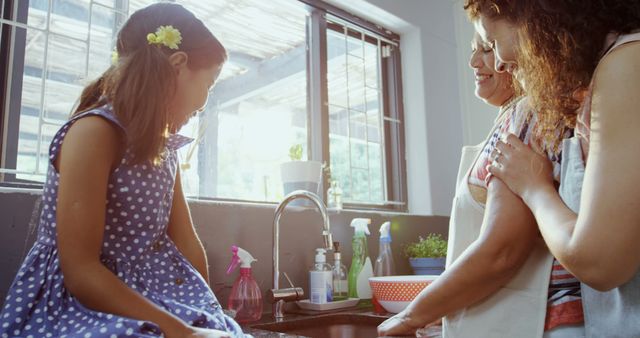 Smiling Family in Kitchen Engaging in Conversation Near Sink - Download Free Stock Images Pikwizard.com