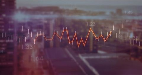 Displaying financial market overlay over blurred city skyline at dusk with orange chart