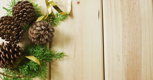 Image of christmas decorations with pine cones and copy space on wooden background - Download Free Stock Photos Pikwizard.com