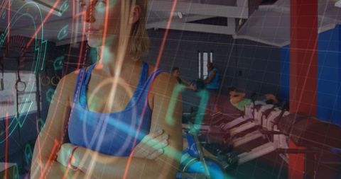 Female athlete watching rowing workout while crossing arms with futuristic hud fitness overlay