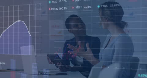 Female Entrepreneurs Discussing Financial Data and Strategies