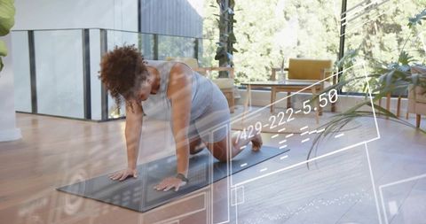 Woman doing kneeling plank with smartwatch and ar fitness overlays in modern sunlit living room