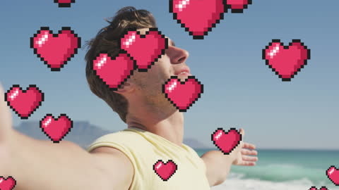 Relaxed Man at Beach with Floating Pixel Hearts Overlay