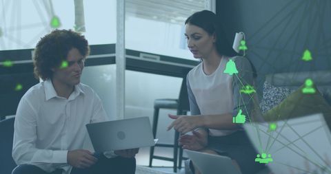 Colleagues Discussing Digital Strategy in Modern Office with Tech Icons