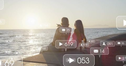 Couple Enjoying Sunset at Seaside Pier with Social Media Overlay