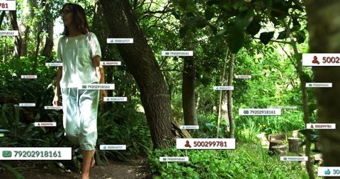 Woman Walking in Forest with Digital Labels Overlay