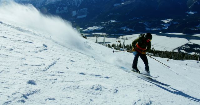 Person skiing down a steep, snow-covered mountain at high speed. The skier creates a trail of snow behind them, showcasing the thrill and exhilaration of the sport. Ideal for promoting winter sports, travel destinations, outdoor adventures, and adrenaline-filled activities.