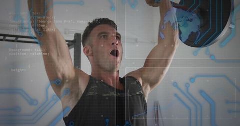 Strong Athlete Embracing Fitness Technology in Modern Gym Atmosphere