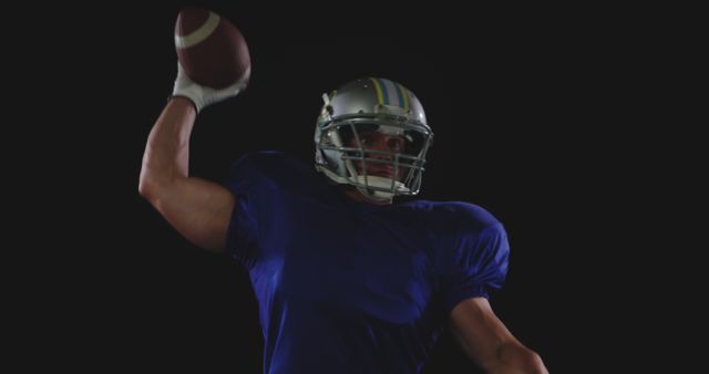 American Football Player Preparing to Throw Ball Against Black Background - Download Free Stock Images Pikwizard.com