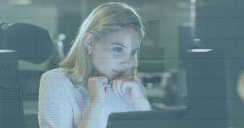 Thoughtful Businesswoman Analyzing Data on Computer