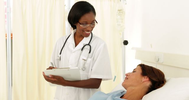 Friendly Nurse Attending to Female Patient in Hospital Room - Download Free Stock Images Pikwizard.com