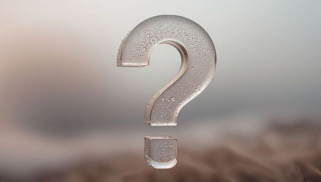 Abstract Glass Question Mark with Dew Drops Over Soft Dusk Desert