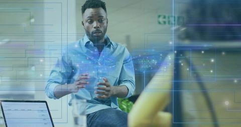 Businessman presenting innovative network hologram in modern office