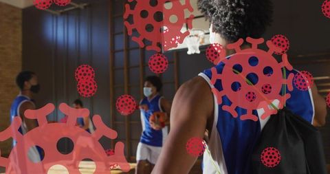 Youth basketball players wearing masks practicing in gym amid coronavirus concerns