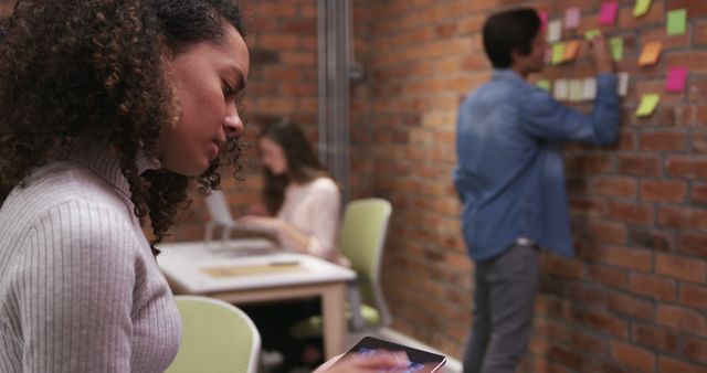 Young Professionals Collaborating in Modern Office with Brick Walls - Download Free Stock Images Pikwizard.com