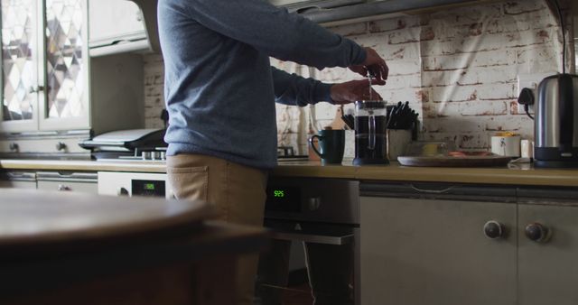 Man Brewing Coffee in Rustic Kitchen - Download Free Stock Images Pikwizard.com