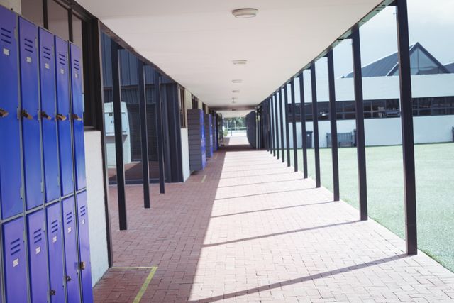 Empty corridor at school during sunny day