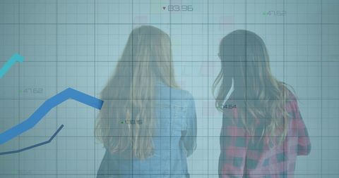 Businesswomen Analyzing Financial Graph