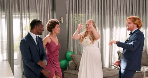 Joyful Multiracial Friends Celebrating Indoor Wedding Reception
