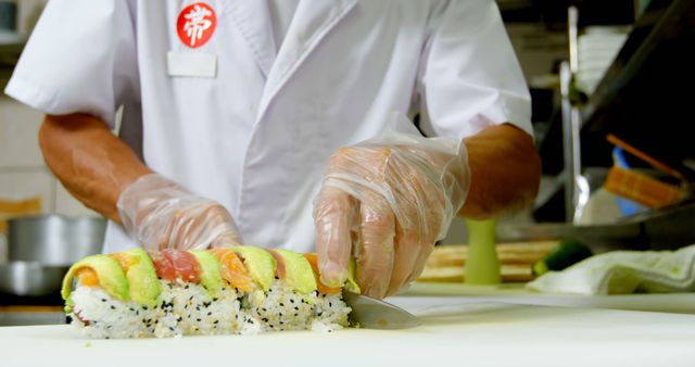 Chef Slicing Colorful Sushi Roll on Cutting Board - Download Free Stock Images Pikwizard.com