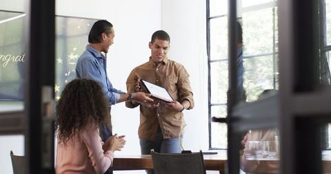 Diverse Colleagues Celebrating Achievement with Award Ceremony
