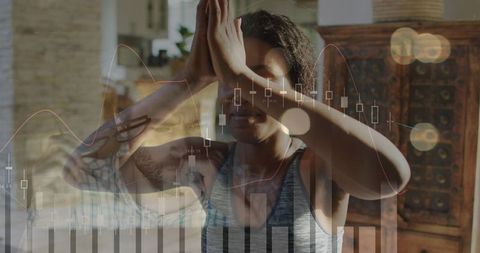 Woman meditating while balancing mindfulness and financial data double-exposure