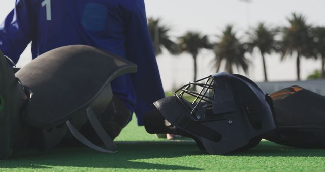 Hockey Goalkeeper Preparing on Field with Equipment - Download Free Stock Images Pikwizard.com