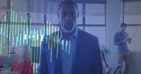 Mature executive analyzing financial data in modern office