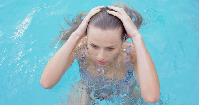 Woman Enjoying Refreshing Swim in Pool - Download Free Stock Images Pikwizard.com