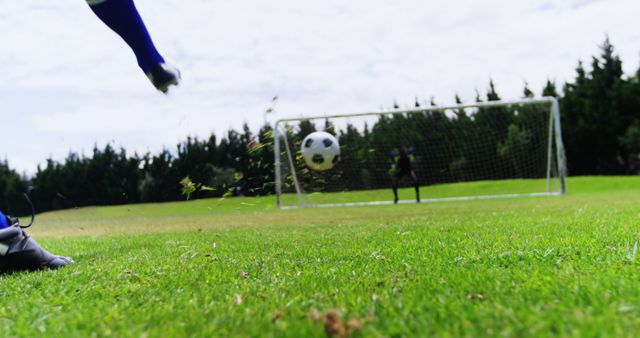 Soccer Player Kicking Ball into Goal During Outdoor Practice - Download Free Stock Images Pikwizard.com