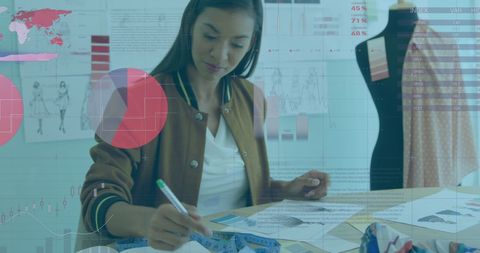 Fashion Designer Analyzing Data in Studio Environment