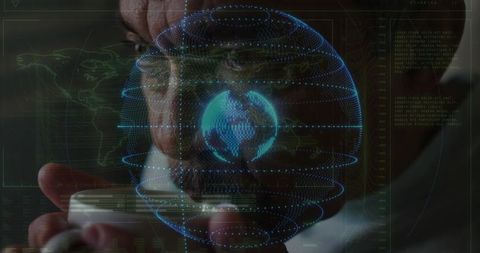 Senior researcher studying holographic globe while holding cup, ar data interface