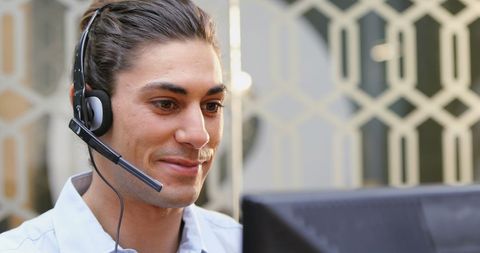Confident Customer Service Professional with Headset Assisting Clients