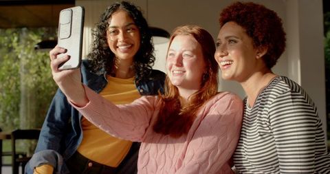 Diverse Female Friends Taking Selfie on Sunny Porch