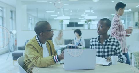 Diverse business team discussing projects in modern office