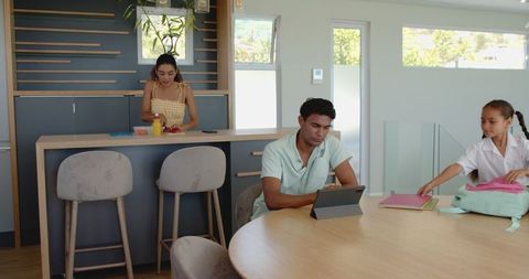 Family morning routine daughter prepares for school assisted by parents