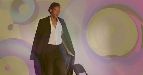 Dynamic model posing in vibrant artistic lighting