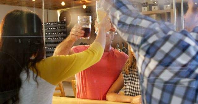 Friends Toasting Drinks in Modern Brewery Setting - Download Free Stock Images Pikwizard.com