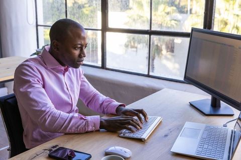 Focused Professional Man Working at Office Computer