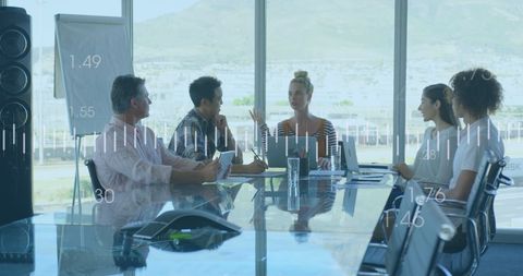 Diverse Team Analyzing Financial Data in Modern Boardroom