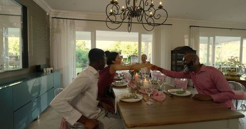 Diverse Group Celebrating Wedding Reception with Elegant Decor