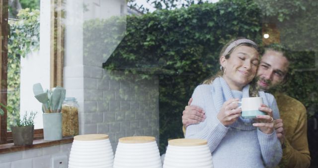 Happy Couple Embracing Through Kitchen Window with Coffee Mug - Download Free Stock Images Pikwizard.com