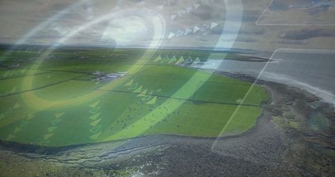 Aerial coastal farmland with futuristic digital overlay